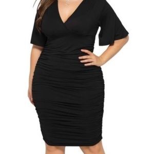 Bombshell black dress fits like a small and medium